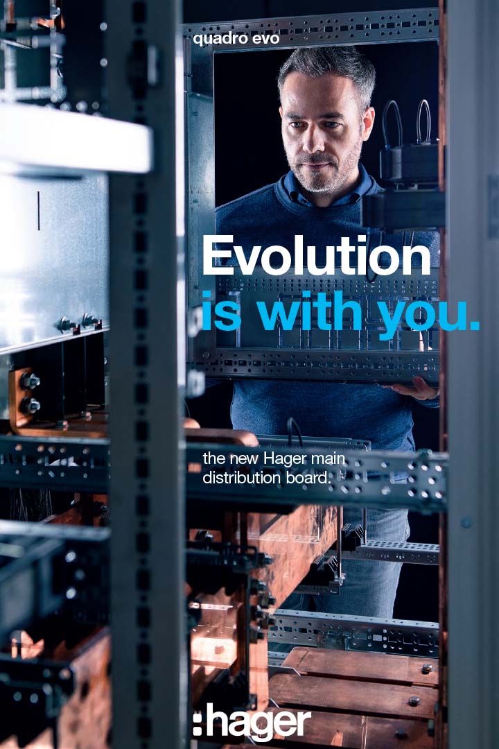 Person inspecting a Hager main distribution board for electrical systems, with emphasis on evolution and innovation